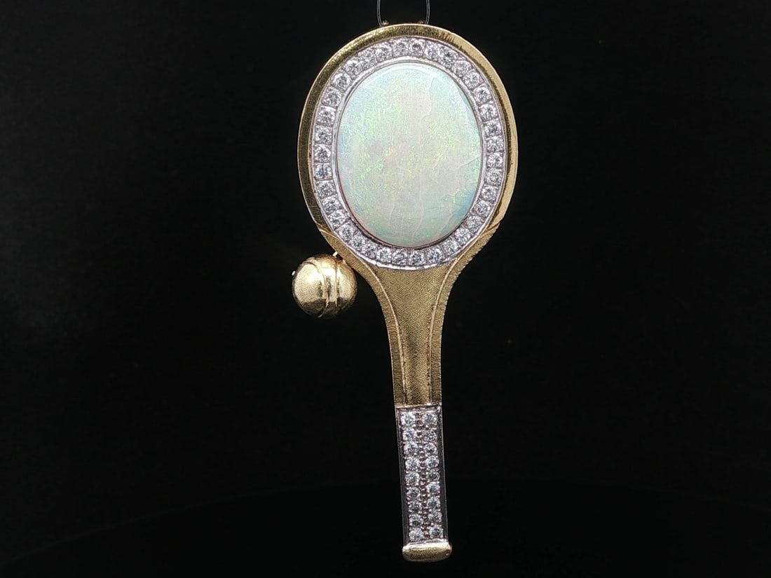 Gold Opal Diamond Tennis Racket Brooch Pendant: Gold Opal Diamond Tennis Racket Brooch Pendant This vintage tennis racket brooch pin pendant features a striking design crafted in solid yellow and white gold, with a 14k gold pin. The piece is adorne