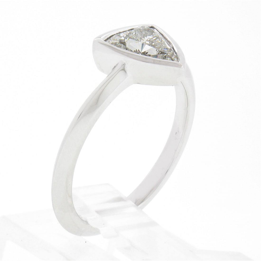 Platinum GIA Certified 1.01ctw Trillion Cut Diamond Bezel Engagement Ring: Platinum GIA Certified 1.01ctw Trillion Cut Diamond Bezel Engagement Ring This stunning engagement ring features a GIA certified 1.01 carat trillion cut diamond, elegantly bezel set in solid 950 plati