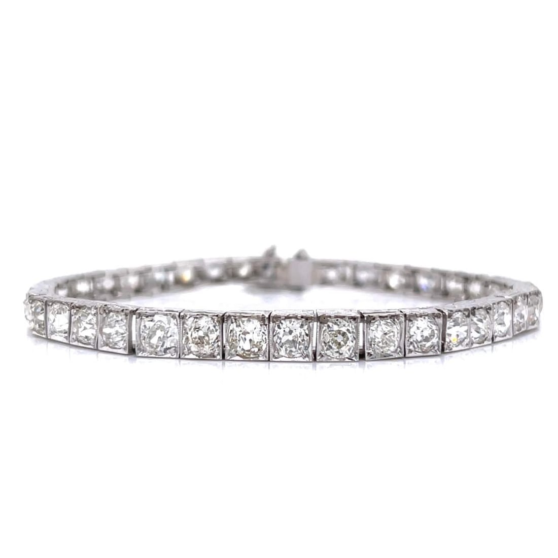 Art Deco Platinum Bracelet 12.00 Ct Old Mine Diamonds F-I VS1-SI1: Art Deco Platinum Bracelet 12.00 Ct Old Mine Diamonds F-I VS1-SI1 This stunning Art Deco bracelet is crafted in platinum and features a remarkable total diamond weight of approximately 12.00 carats. T