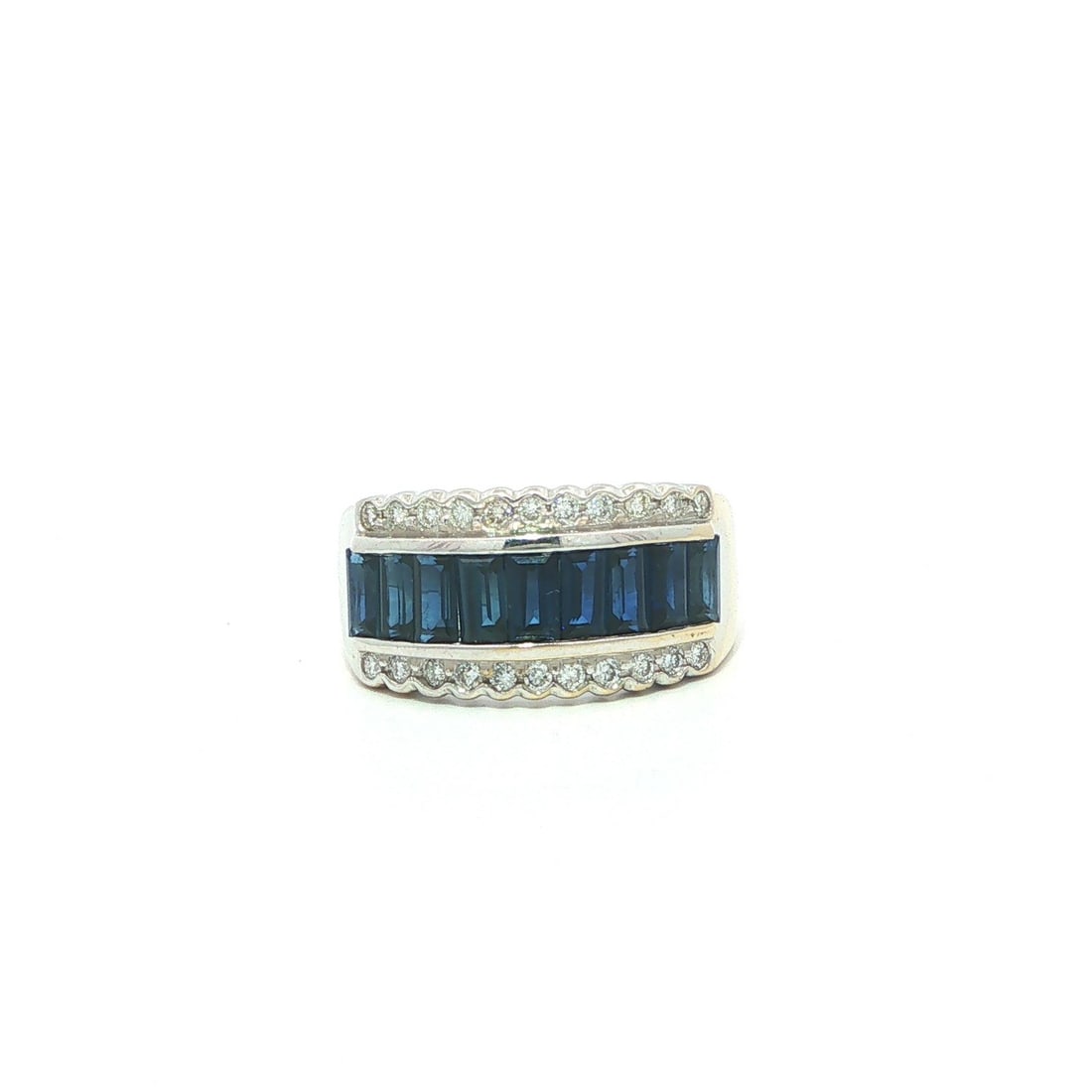 Unbranded 18k White Gold Band Ring with Baguette Sapphires and Diamonds: Unbranded 18k White Gold Band Ring with Baguette Sapphires and Diamonds Vintage women's band ring featuring natural blue baguette sapphires accented by natural diamonds in a border design. Crafted in