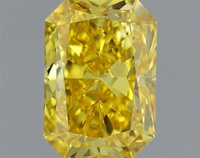 Loose Diamond - RADIANT 0.72ct Fancy Vivid Yellow VS2: Loose Diamond - RADIANT 0.72ct Fancy Vivid Yellow VS2 Source: This is a real non-mined Diamond that has been grown in a lab Shape: RADIANT Carats: 0.72 Color: Fancy Vivid Yellow Certification: IGI Vid