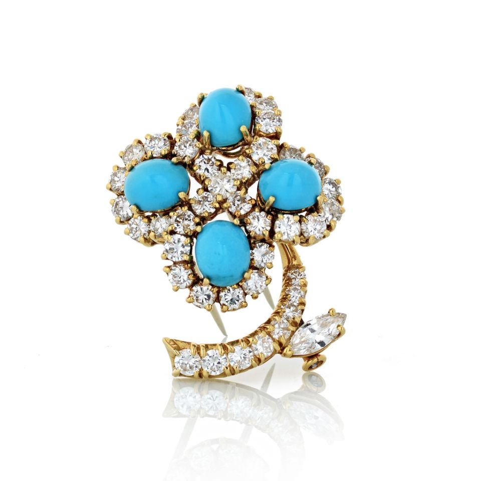 18K Yellow Gold Flower Brooch with Turquoise and Diamonds: 18K Yellow Gold Flower Brooch with Turquoise and Diamonds This exquisite flower brooch is crafted in luxurious 18K yellow gold and features a stunning arrangement of turquoise and diamonds. Measuring 