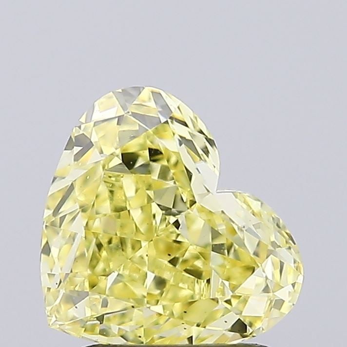 Loose Diamond - HEART 1.53ct Fancy Vivid Yellow VS2: Loose Diamond - HEART 1.53ct Fancy Vivid Yellow VS2 Source: This is a real non-mined Diamond that has been grown in a lab Shape: HEART Carats: 1.53 Color: Fancy Vivid Yellow Certification: IGI Video: