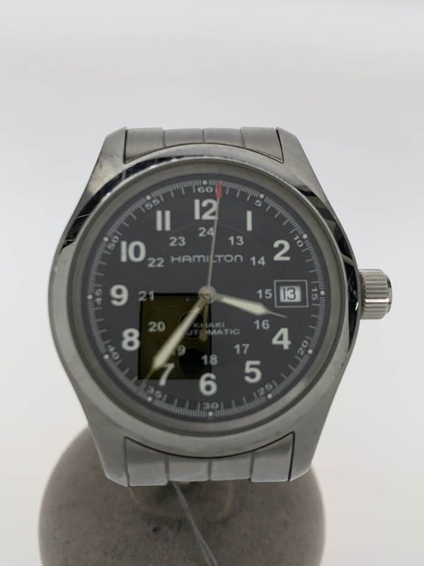 Hamilton stainless steel Khaki Field men's wristwatch black dial: Hamilton stainless steel Khaki Field men's wristwatch black dial This is a pre-owned Hamilton Khaki Field H704450 men's wristwatch. The watch features a black dial and a stainless steel case and band.