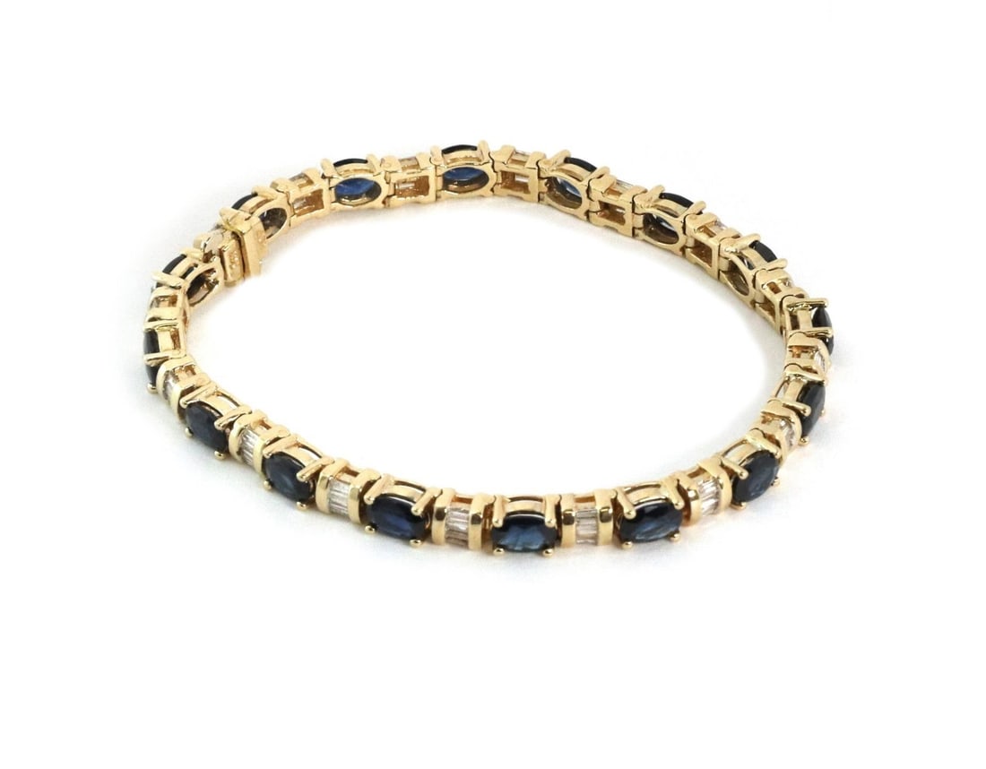Elegant 14k Yellow Gold Diamond Sapphire Tennis Bracelet 7 Inch: Elegant 14k Yellow Gold Diamond Sapphire Tennis Bracelet 7 Inch This exquisite tennis bracelet showcases a stunning design crafted from 14k yellow gold with a polished finish. The bracelet features 16