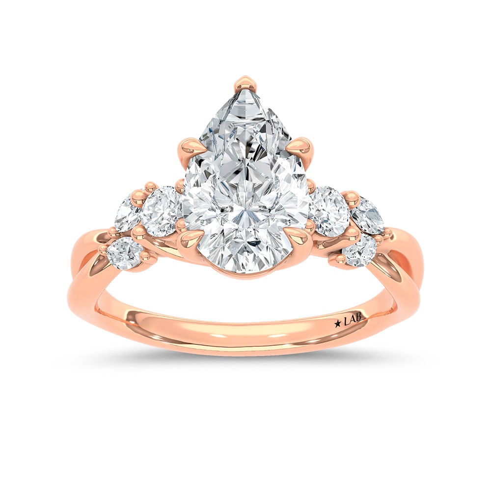 14K Rose Gold 2 1/3 Ct.Tw. Lab Grown Diamond Pear Shape Engagement Ring (IGI Certified Center 2ct: 14K Rose Gold 2 1/3 Ct.Tw. Lab Grown Diamond Pear Shape Engagement Ring (IGI Certified Center 2ct Pear) Celebrate your love with this elegant 14K Rose gold engagement ring, featuring a 2-carat IGI-cer