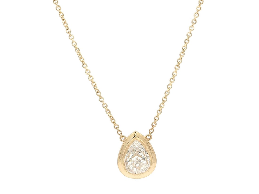 18k Yellow Gold GIA Certified 1.19ct Pear Diamond Pendant Necklace: 18k Yellow Gold GIA Certified 1.19ct Pear Diamond Pendant Necklace This elegant 18k Gold GIA certified pendant necklace features a stunning pear-shaped diamond, meticulously set in a milgrain bezel. T