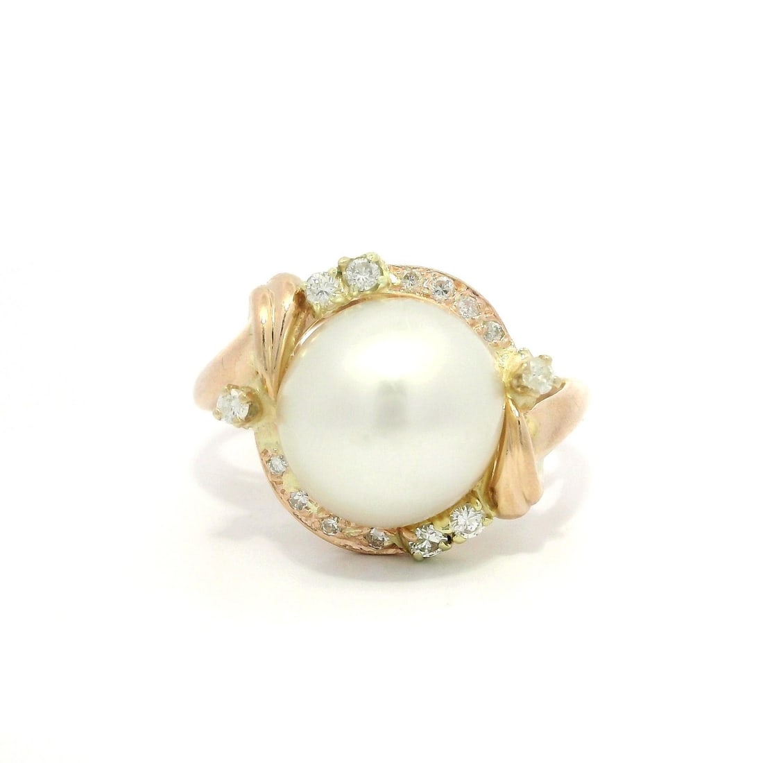 Elegant 14k Yellow Gold Pearl and Diamond Halo Cocktail Ring: Elegant 14k Yellow Gold Pearl and Diamond Halo Cocktail Ring This stunning cocktail ring features a genuine cultured pearl set in solid 14k yellow gold, beautifully accented by a halo of 14 round bril