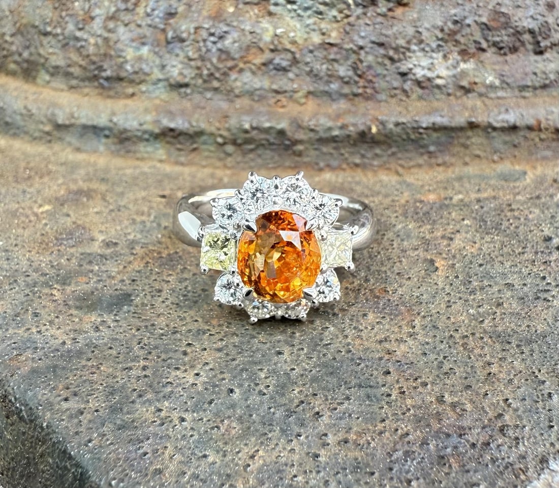 Platinum Ring with GIA Yellowish Orange Oval Sapphire and Princess Cut Diamonds 3.13ctw