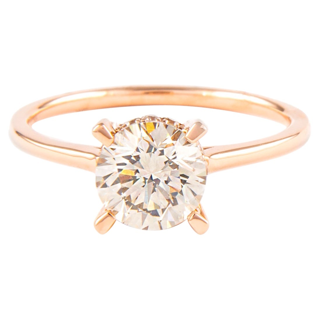 1.31 Carat Round Brilliant Diamond Solitaire Ring in 18K Rose Gold: 1.31 Carat Round Brilliant Diamond Solitaire Ring in 18K Rose Gold This exquisite 1.31 Carat Round Brilliant Diamond Solitaire Ring is crafted in 18 Karat Rose Gold, showcasing a classic solitaire des