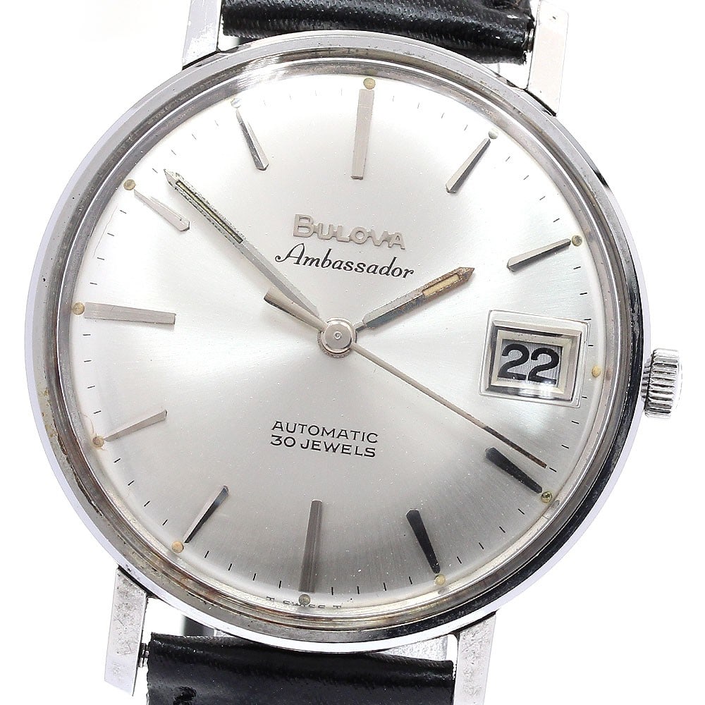 Bulova automatic date wristwatch men's stainless steel 35mm: Bulova automatic date wristwatch men's stainless steel 35mm This vintage Bulova men's wristwatch features a stainless steel case and an unused leather bracelet. The watch has a silver dial with date f