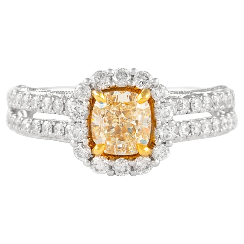 1.68ct Fancy Yellow Diamond Ring 18k Certified EGL: 1.68ct Fancy Yellow Diamond Ring 18k Certified EGL This stunning ring features a 1.68ctt Fancy Yellow VS2 cushion cut diamond, elegantly set in a two-tone 18k gold band that combines both yellow and w
