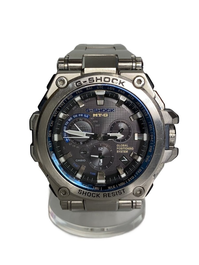 CASIO MTG-G1000D-1A2JF Silver Men's Wristwatch: CASIO MTG-G1000D-1A2JF Silver Men's Wristwatch This CASIO G-SHOCK MTG-G1000D-1A2JF men's wristwatch features a silver-tone case and band. Made in Japan, this pre-owned timepiece is graded as Grade B, 