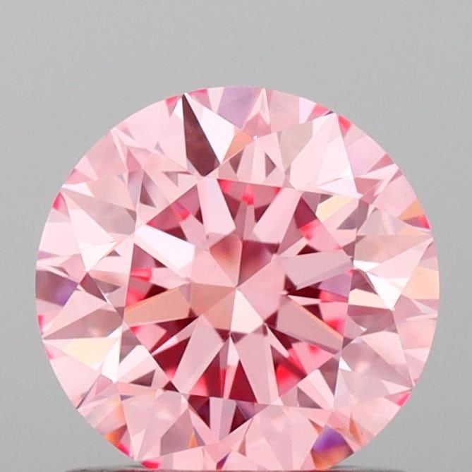 Loose Diamond - ROUND 0.87ct Fancy Vivid Pink VVS2: Loose Diamond - ROUND 0.87ct Fancy Vivid Pink VVS2 Source: This is a real non-mined Diamond that has been grown in a lab Shape: ROUND Carats: 0.87 Color: Fancy Vivid Pink Certification: IGI Video: