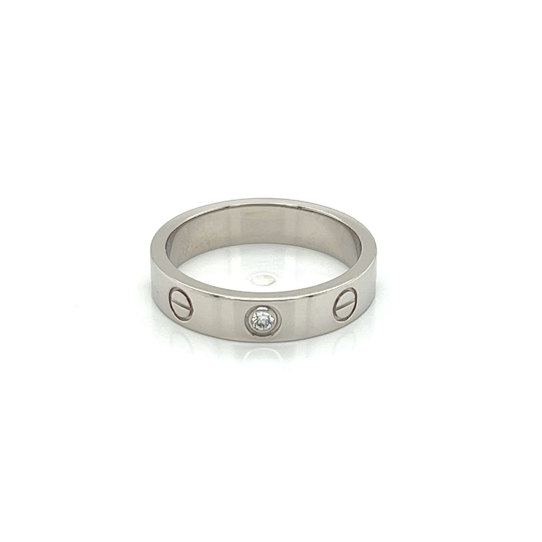 Cartier LOVE Mini Ring 18k White Gold Diamond Band Size 5 Certificate: Cartier LOVE Mini Ring 18k White Gold Diamond Band Size 5 Certificate A pre-owned Cartier LOVE Mini diamond band ring crafted in 18k white gold. The ring features Cartier's signature screw motifs and 