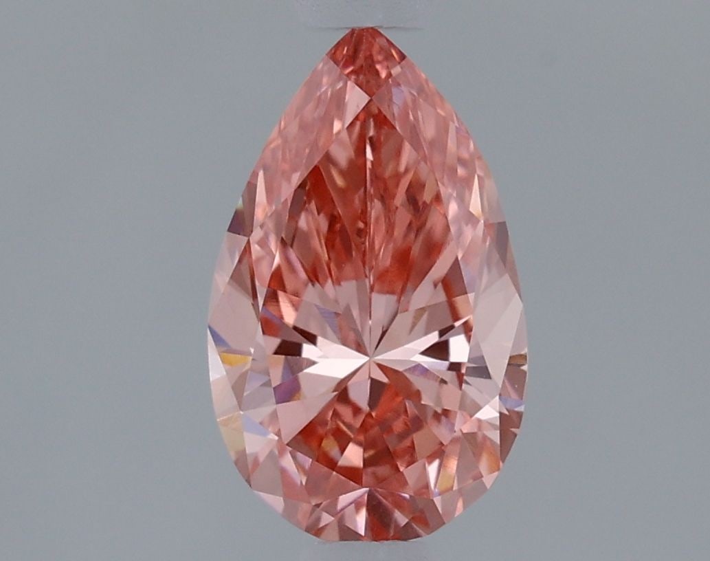 Loose Diamond - PEAR 0.97ct Fancy Vivid Pink VVS2: Loose Diamond - PEAR 0.97ct Fancy Vivid Pink VVS2 Source: This is a real non-mined Diamond that has been grown in a lab Shape: PEAR Carats: 0.97 Color: Fancy Vivid Pink Certification: IGI Video: