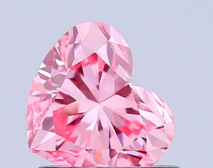 Loose Diamond - HEART 0.8ct Fancy Vivid Pink VS1: Loose Diamond - HEART 0.8ct Fancy Vivid Pink VS1 Source: This is a real non-mined Diamond that has been grown in a lab Shape: HEART Carats: 0.8 Color: Fancy Vivid Pink Certification: IGI Video: