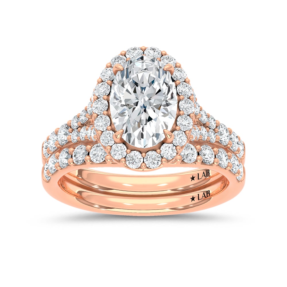 14K Rose Gold 3 Ct.Tw. Lab Grown Diamond Oval Shape Bridal Ring (IGI Certified Center 2ct Oval): 14K Rose Gold 3 Ct.Tw. Lab Grown Diamond Oval Shape Bridal Ring (IGI Certified Center 2ct Oval) 14k Rose Gold Stone Color: D-f Stone Clarity: Vs Each ring is presented in standard size 6.5. Compliment