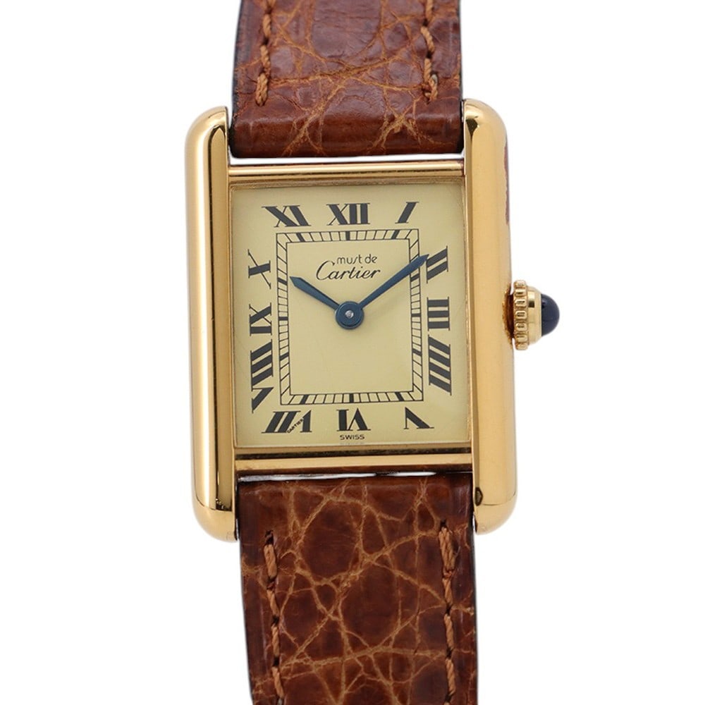 Cartier W1003153 Must Tank SM quartz wristwatch leather strap: Cartier W1003153 Must Tank SM quartz wristwatch leather strap Vintage Cartier Must Tank SM wristwatch with a quartz movement and leather strap. This pre-owned unisex watch was made in Switzerland. Spe