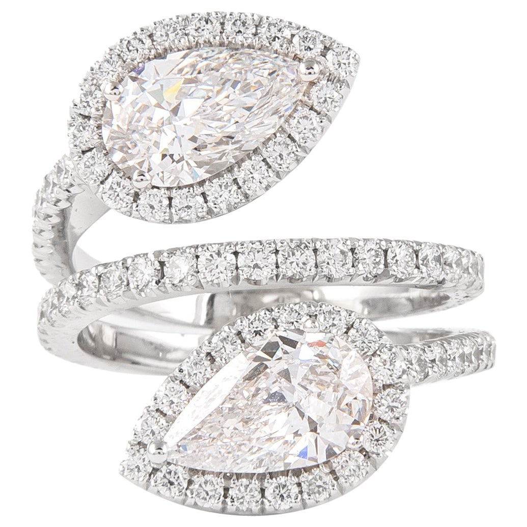 3.24ct GIA Toi et Moi Diamond Bypass Ring 18k White Gold: 3.24ct GIA Toi et Moi Diamond Bypass Ring 18k White Gold This exquisite 18k white gold ring features a stunning Toi et Moi design, showcasing two pear-cut diamonds with a combined weight of 2.10 ct, b