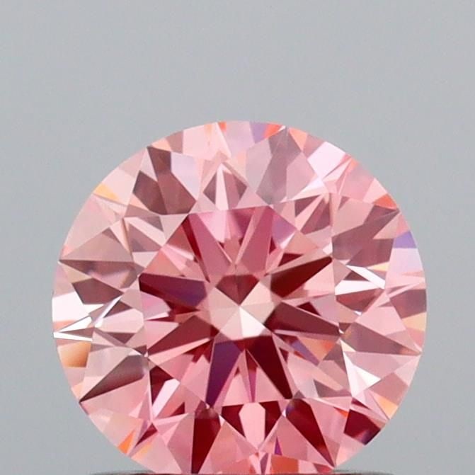 Ideal Loose Diamond - ROUND 0.9ct Fancy Vivid Pink VVS1: Ideal Loose Diamond - ROUND 0.9ct Fancy Vivid Pink VVS1 Source: This is a real non-mined Diamond that has been grown in a lab Shape: ROUND Carats: 0.9 Color: Fancy Vivid Pink Certification: IGI Video: