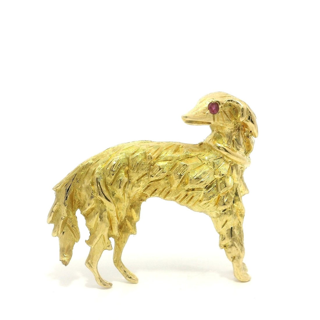 18k Yellow Gold Ruby Eye Borzoi Dog Brooch Pin: 18k Yellow Gold Ruby Eye Borzoi Dog Brooch Pin This exquisite brooch features a detailed Borzoi sighthound design, crafted from solid 18k yellow gold. The dog's captivating ruby eye, made from natural