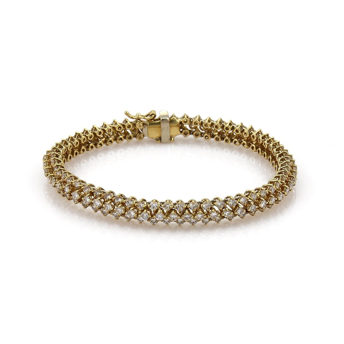 18k Yellow Gold Triple Row Diamond Tennis Bracelet 8 Carats: 18k Yellow Gold Triple Row Diamond Tennis Bracelet 8 Carats This exquisite tennis bracelet is crafted from 18k yellow gold, showcasing a polished finish. It features a unique triple row design with sm