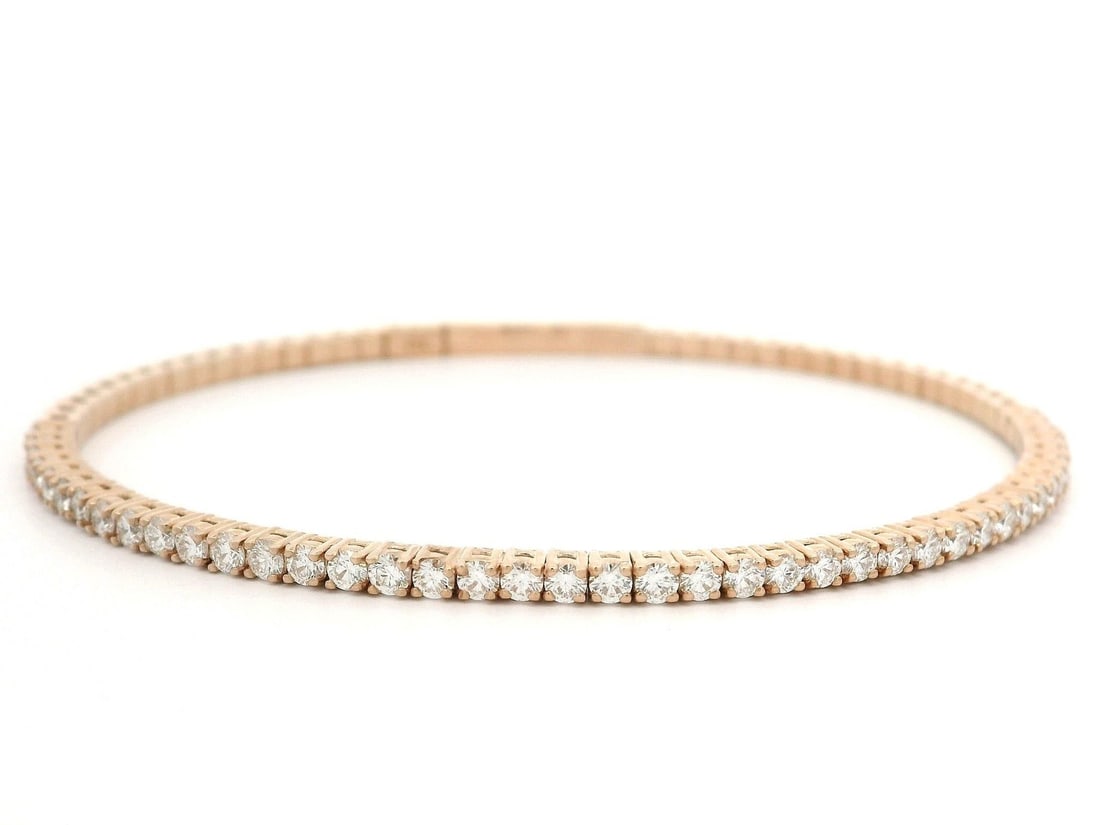 14k Rose Gold 1.36ctw Diamond Bangle Bracelet Flexible Design: 14k Rose Gold 1.36ctw Diamond Bangle Bracelet Flexible Design This stunning flexible bangle bracelet is crafted from solid 14k rose gold and features a total of 42 natural diamonds in a brilliant cut.
