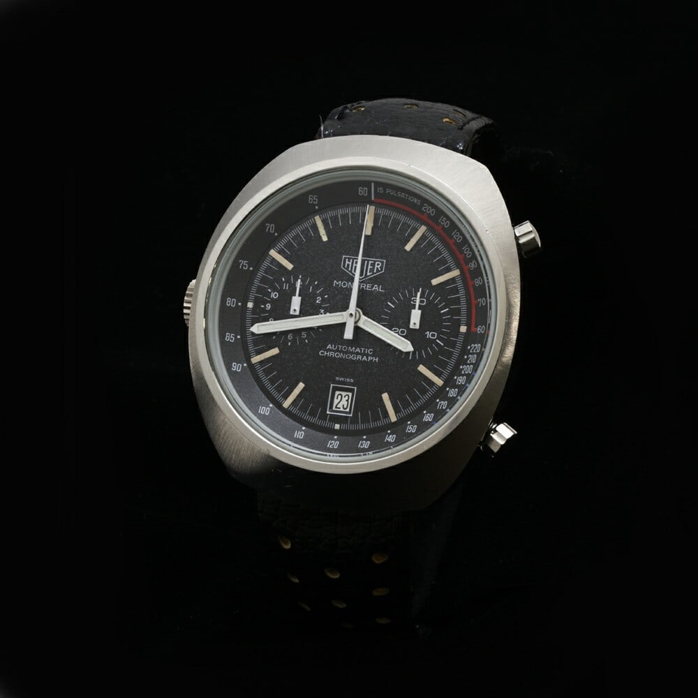 Heuer Montreal 1970s Chronograph Stainless Steel Men's Wristwatch: Heuer Montreal 1970s Chronograph Stainless Steel Men's Wristwatch This Heuer Montreal Chronograph 29TAGOLD CAL.12 is a vintage men's wristwatch from the 1970s, featuring a stainless steel case and a m