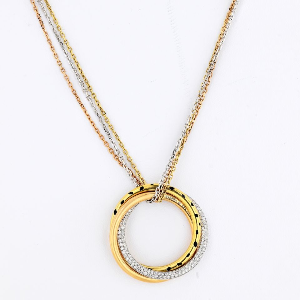 Cartier Trinity 18K Tri-Color Diamond Pendant on Triple Chain: Cartier Trinity 18K Tri-Color Diamond Pendant on Triple Chain This stunning Cartier Trinity pendant is crafted from 18K tri-color gold, combining white, yellow, and pink hues for a timeless appeal. Th
