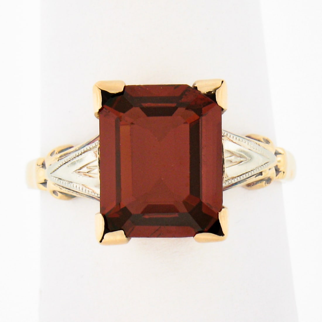 Art Nouveau 14k Two Tone Gold Ring 3ct Rhodolite Garnet Solitaire: Art Nouveau 14k Two Tone Gold Ring 3ct Rhodolite Garnet Solitaire Antique Art Nouveau solitaire ring crafted in solid 14k two-tone gold, featuring a natural rhodolite garnet in an emerald cut. The cen