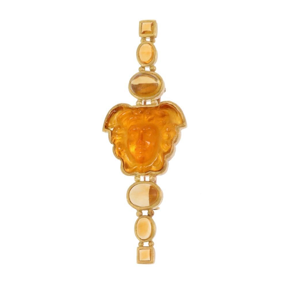 Elizabeth Locke 18k Yellow Gold Medusa Citrine Brooch with Mother of Pearl: Elizabeth Locke 18k Yellow Gold Medusa Citrine Brooch with Mother of Pearl This exquisite brooch by designer Elizabeth Locke showcases a stunning craftsmanship in 18k yellow gold. The piece features a
