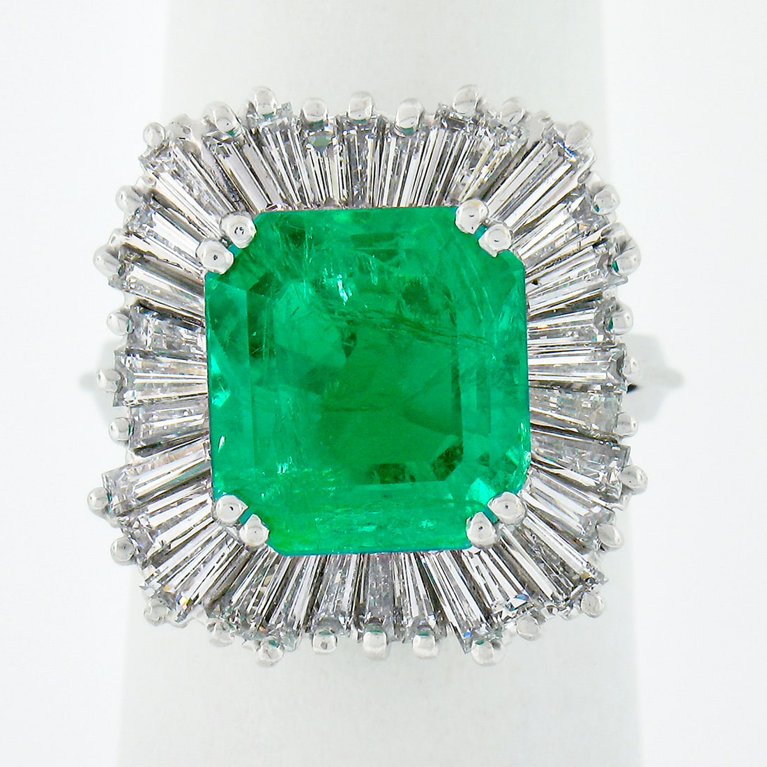 AGL Certified 7.67ctw Colombian Emerald Diamond Ballerina Ring: AGL Certified 7.67ctw Colombian Emerald Diamond Ballerina Ring This stunning vintage ballerina-style ring is crafted in solid 18k white gold and features a mesmerizing natural emerald cut Colombian em