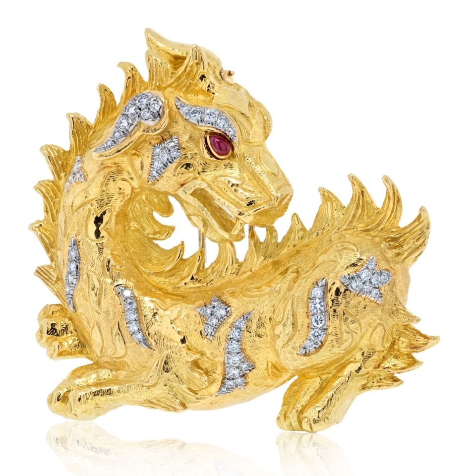 David Webb Dragon Brooch Platinum 18K Yellow Gold Diamonds Ruby Eyes: David Webb Dragon Brooch Platinum 18K Yellow Gold Diamonds Ruby Eyes This David Webb brooch showcases an elaborate dragon motif, expertly crafted from platinum and 18K yellow gold. The piece is adorne