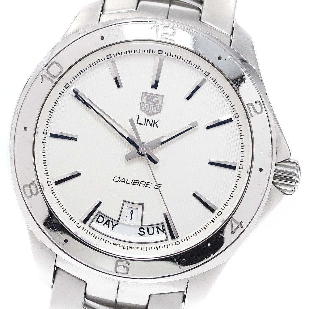 TAG Heuer Link Day-Date Men's Wristwatch: TAG Heuer Link Day-Date Men's Wristwatch This TAG HEUER Link Day-Date men's wristwatch features Swiss craftsmanship and is designed for men. It is a pre-owned model, offering the reliability and style
