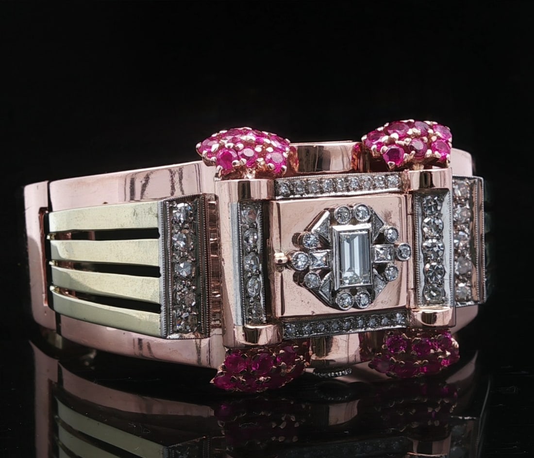 Bulova 14k Rose Green Gold Hidden Watch Bangle with Diamonds and Rubies: Bulova 14k Rose Green Gold Hidden Watch Bangle with Diamonds and Rubies This vintage Bulova hidden watch bangle bracelet features a blend of 14k rose and green gold, adorned with approximately 2.68 ca