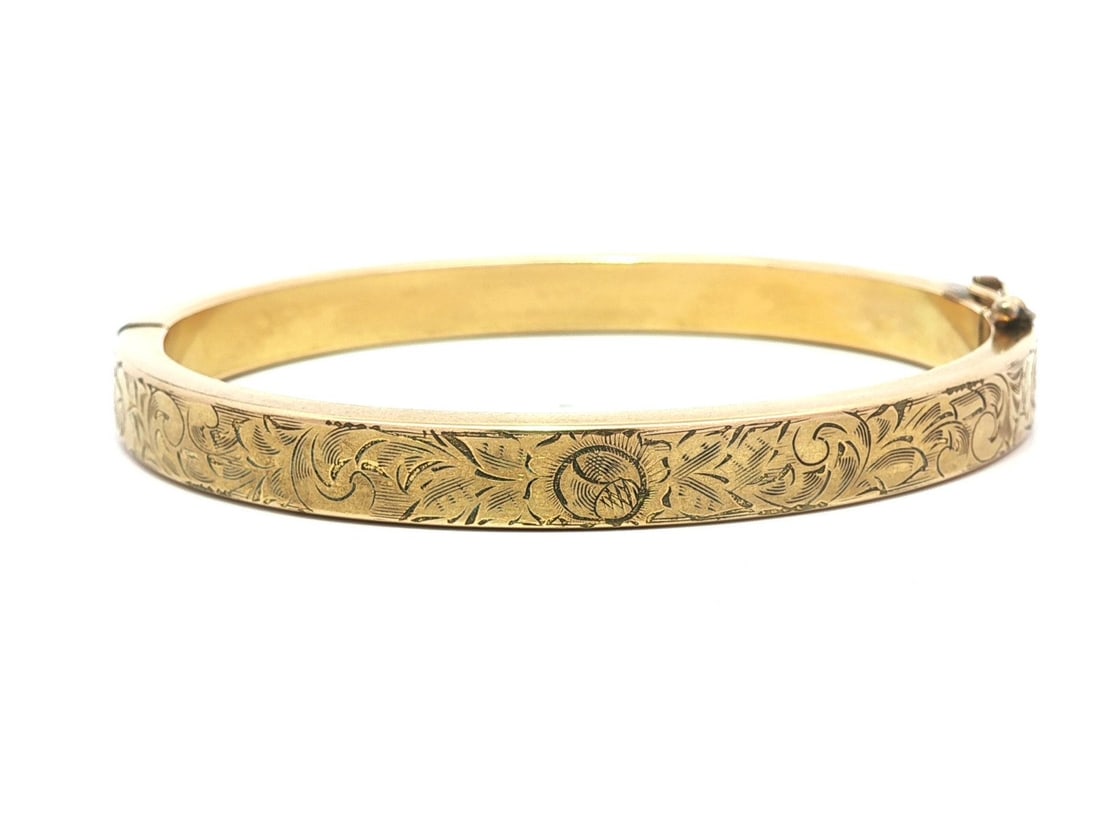 Hand Engraved Floral Gold Filled Hinged Bangle Bracelet Vintage 6.75 Inch: Hand Engraved Floral Gold Filled Hinged Bangle Bracelet Vintage 6.75 Inch This vintage bangle bracelet features a solid gold filled construction with hand-engraved floral patterns. It is designed as a
