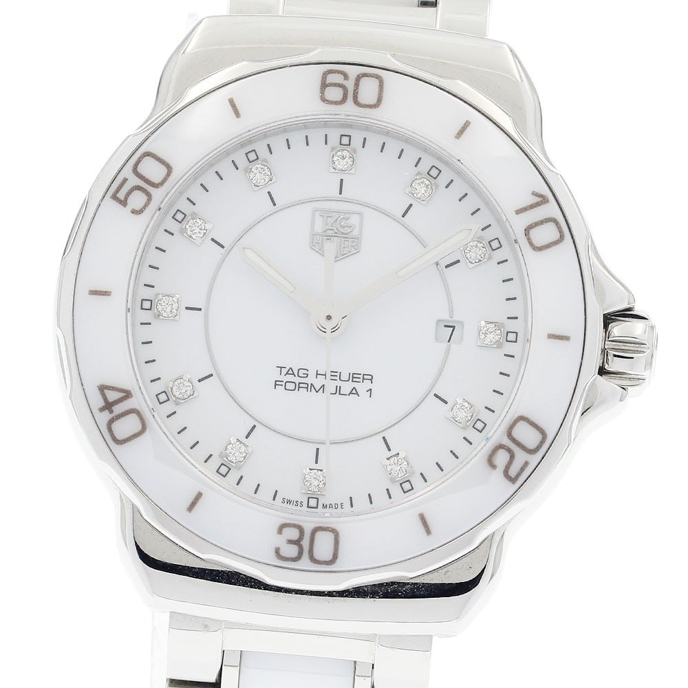 TAG Heuer Formula 1 women's quartz date watch 12-diamond white dial: TAG Heuer Formula 1 women's quartz date watch 12-diamond white dial This TAG Heuer Formula 1 women's wristwatch (model WAH1315.BA0868) features a stainless steel and ceramic case and band, complemente