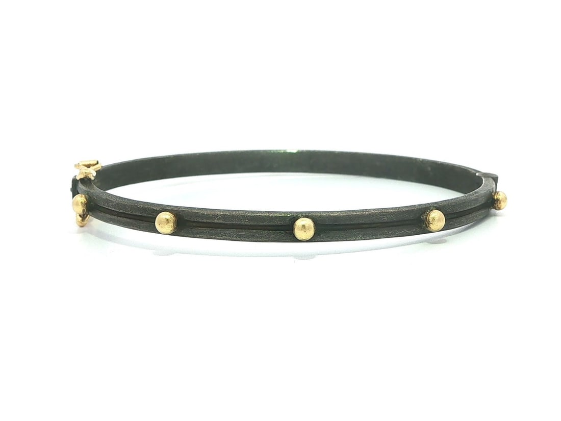 Armenta oxidized sterling silver hinged bangle with 18k yellow gold beads: Armenta oxidized sterling silver hinged bangle with 18k yellow gold beads This Armenta bangle bracelet features a striking design crafted from solid oxidized sterling silver with 18k yellow gold beads