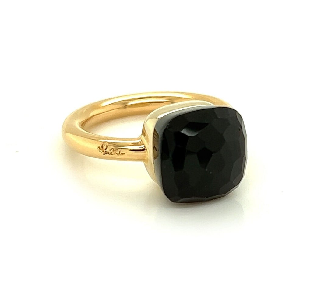 Pomellato Nudo garnet ring in 18k rose and white gold size 4.5: Pomellato Nudo garnet ring in 18k rose and white gold size 4.5 This Pomellato Nudo ring features a cushion-cut garnet set in the collection's signature minimalist cushion setting on a slim band. It is