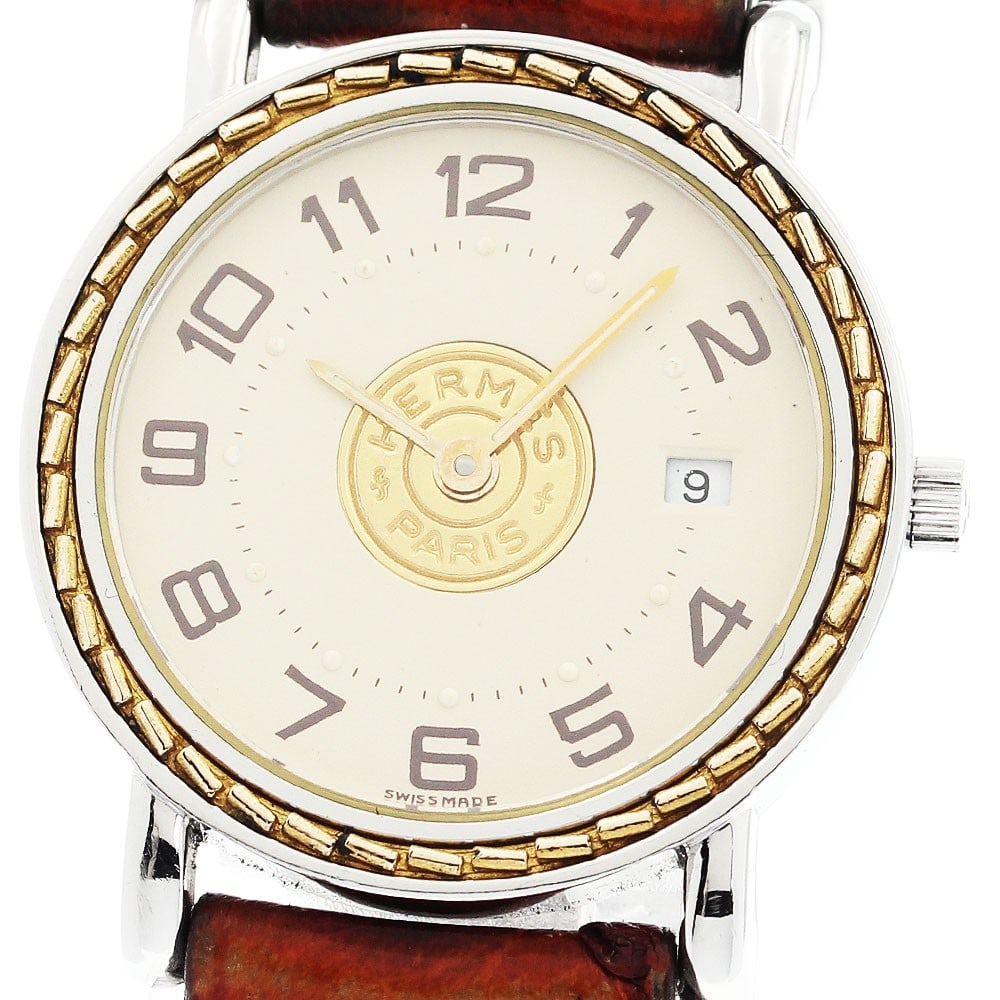Hermes Serie quartz date wristwatch women stainless steel GP: Hermes Serie quartz date wristwatch women stainless steel GP This pre-owned Hermes Serie Date quartz women's wristwatch features a stainless steel and gold-plated case paired with a leather bracelet. 
