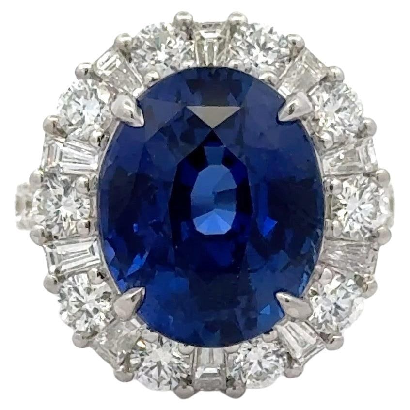 GIA Certified 11.07ct Oval Sapphire Diamond Halo Ring in 18k White Gold: GIA Certified 11.07ct Oval Sapphire Diamond Halo Ring in 18k White Gold This stunning cocktail ring features a GIA Certified Sri Lankan oval-cut sapphire weighing 11.07 carats, surrounded by a dazzlin