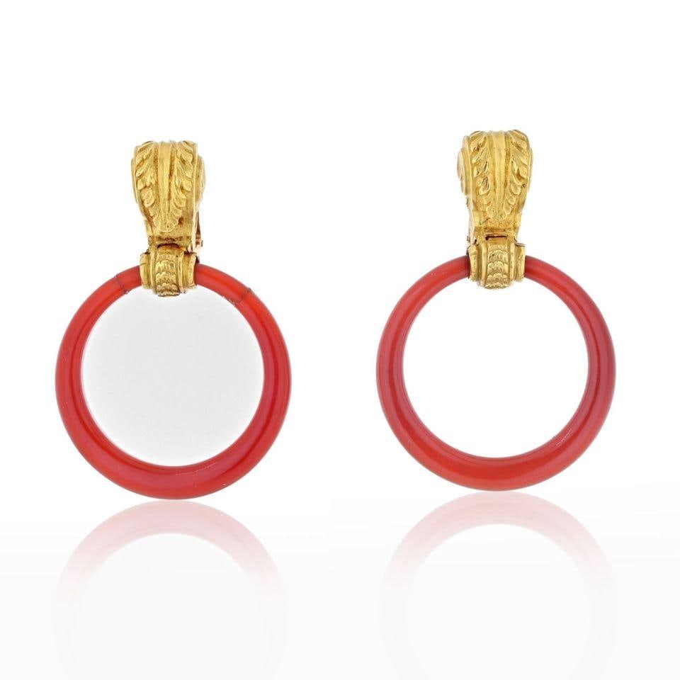 Vintage Bvlgari 18K Yellow Gold Carnelian Doorknocker Earrings: Vintage Bvlgari 18K Yellow Gold Carnelian Doorknocker Earrings These vintage Bvlgari earrings from the 1970s showcase a stunning door knocker design crafted in articulated 18K yellow gold. Featuring v