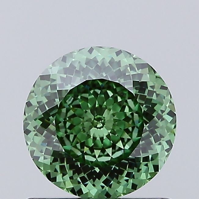 Loose Diamond - ROUND 0.83ct Fancy Vivid Green VS1: Loose Diamond - ROUND 0.83ct Fancy Vivid Green VS1 Source: This is a real non-mined Diamond that has been grown in a lab Shape: ROUND Carats: 0.83 Color: Fancy Vivid Green Certification: IGI Video:
