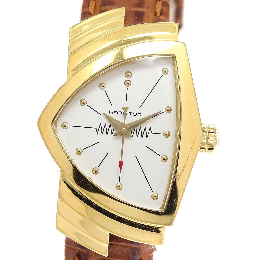 Hamilton Ventura H241010 quartz ladies wristwatch: Hamilton Ventura H241010 quartz ladies wristwatch This Hamilton Ventura Quartz women's wristwatch features a stainless steel and gold-plated case paired with a leather bracelet. The watch has a silver