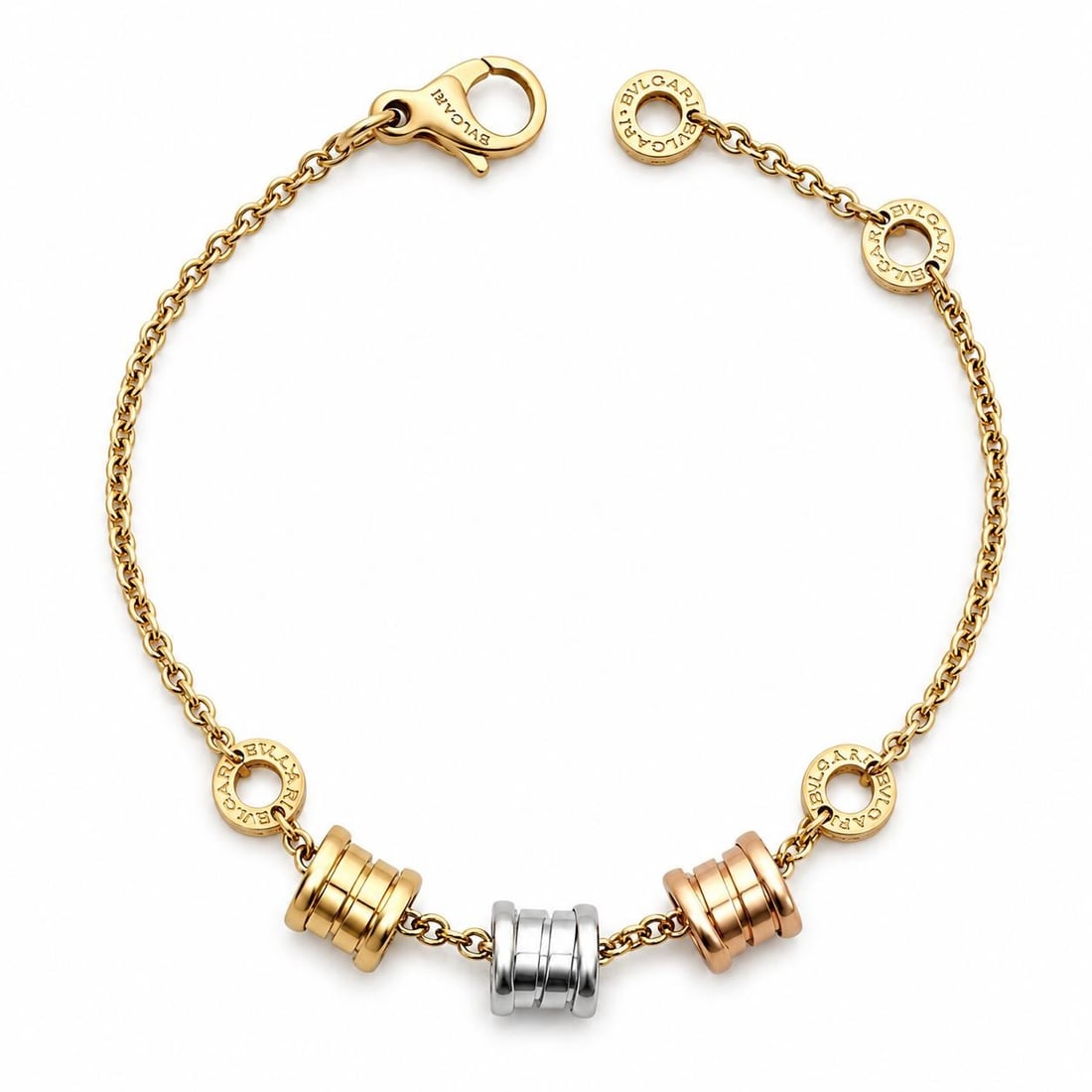 Bvlgari B Zero 1 tri color 18k adjustable link bracelet: Bvlgari B Zero 1 tri color 18k adjustable link bracelet This Bulgari B. Zero 1 bracelet is crafted from solid 18k yellow, rose, and white gold, featuring three spiral links in a tri-color design. The 