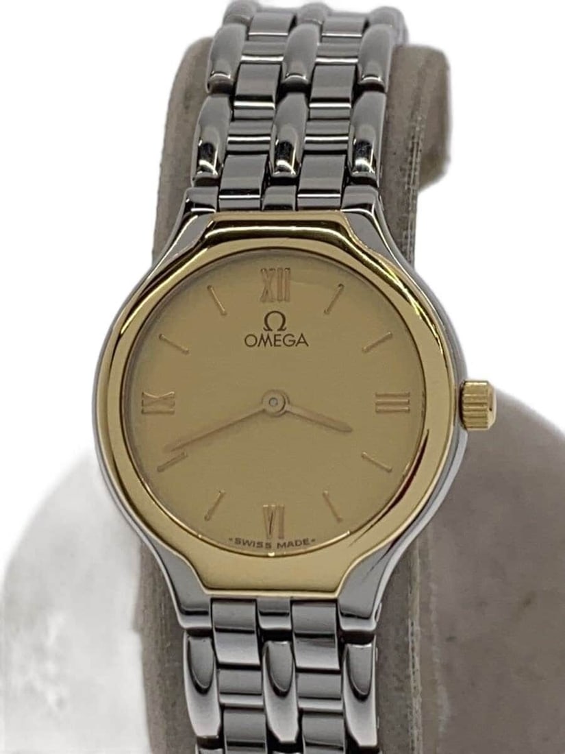 Omega De Ville Quartz Two Tone Women's Wristwatch: Omega De Ville Quartz Two Tone Women's Wristwatch This OMEGA De Ville women's wristwatch features a classic quartz movement and a sophisticated stainless steel and gold combination. Made in Switzerlan