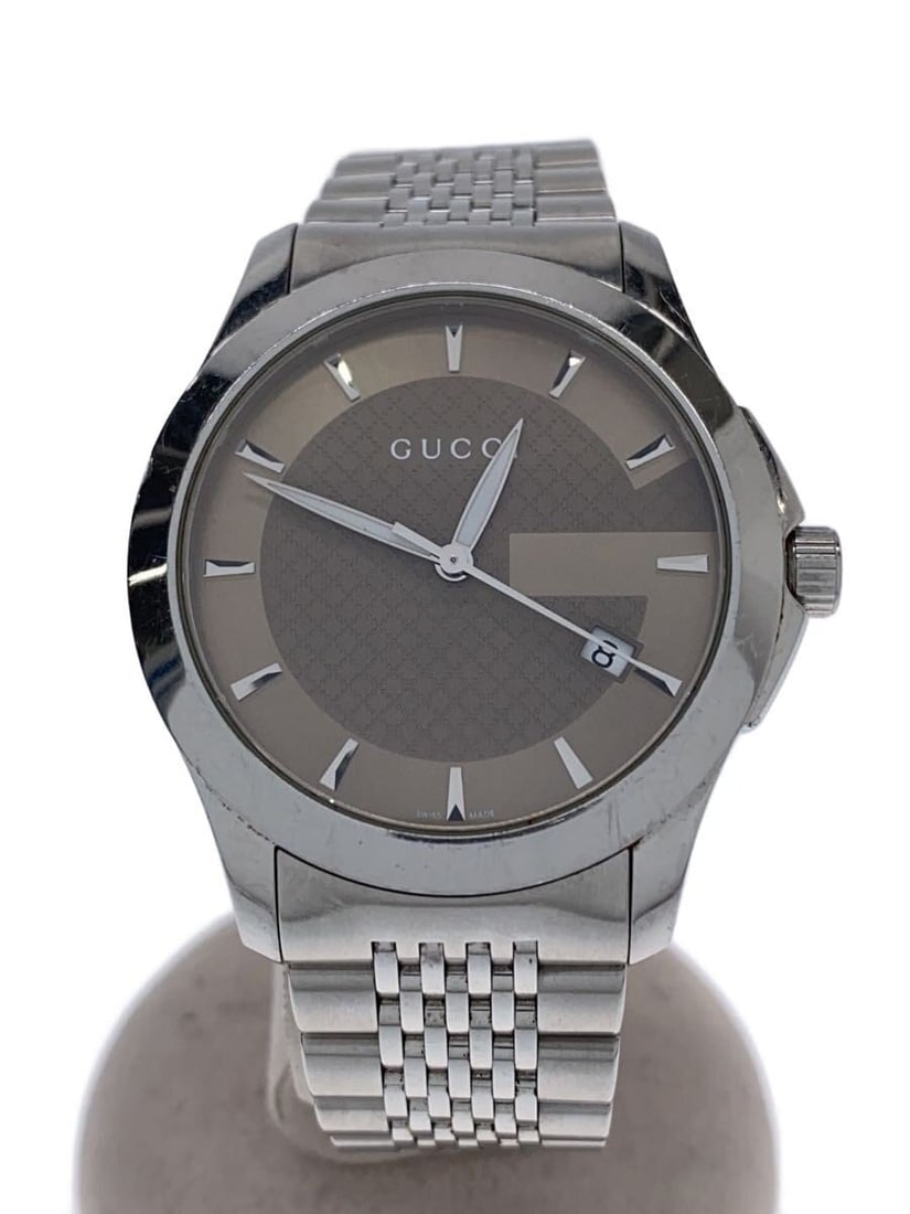 Gucci G Timeless Quartz Stainless Steel Brown Men's Wristwatch: Gucci G Timeless Quartz Stainless Steel Brown Men's Wristwatch This GUCCI G-TIMELESS Quartz 126.4 men's wristwatch features a brown dial and a stainless steel case. Designed in Switzerland, it is a pr