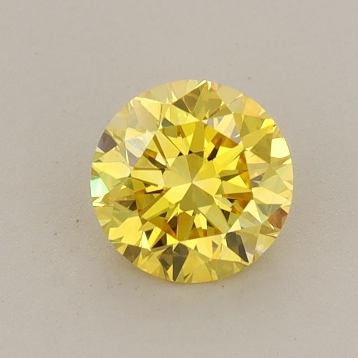 Loose Diamond - ROUND 0.63ct Fancy Vivid Yellow VS1: Loose Diamond - ROUND 0.63ct Fancy Vivid Yellow VS1 Source: This is a real non-mined Diamond that has been grown in a lab Shape: ROUND Carats: 0.63 Color: Fancy Vivid Yellow Certification: IGI Video: