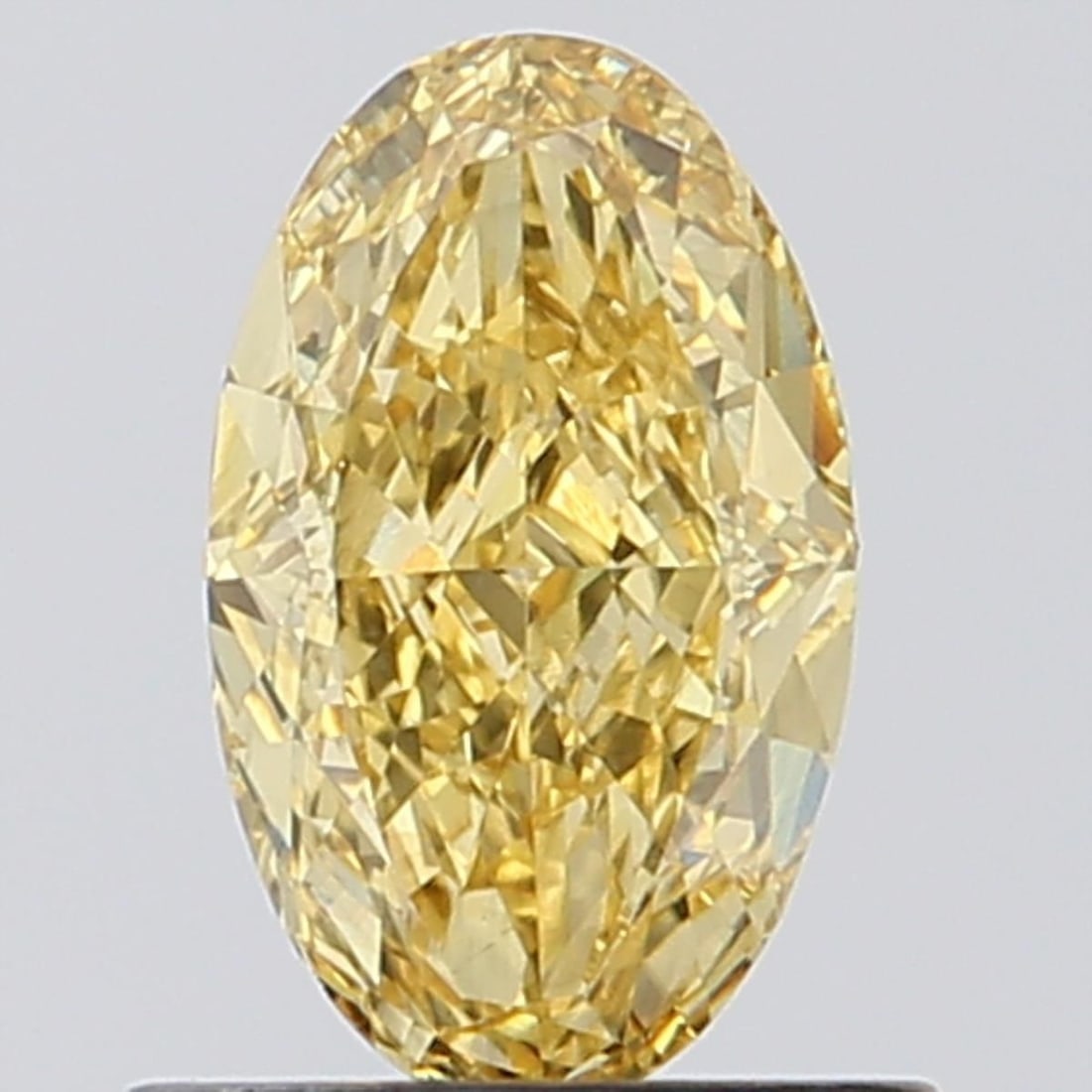 Loose Diamond - OVAL 0.9ct Fancy Vivid Yellow VVS2: Loose Diamond - OVAL 0.9ct Fancy Vivid Yellow VVS2 Source: This is a real non-mined Diamond that has been grown in a lab Shape: OVAL Carats: 0.9 Color: Fancy Vivid Yellow Certification: NONE Video: